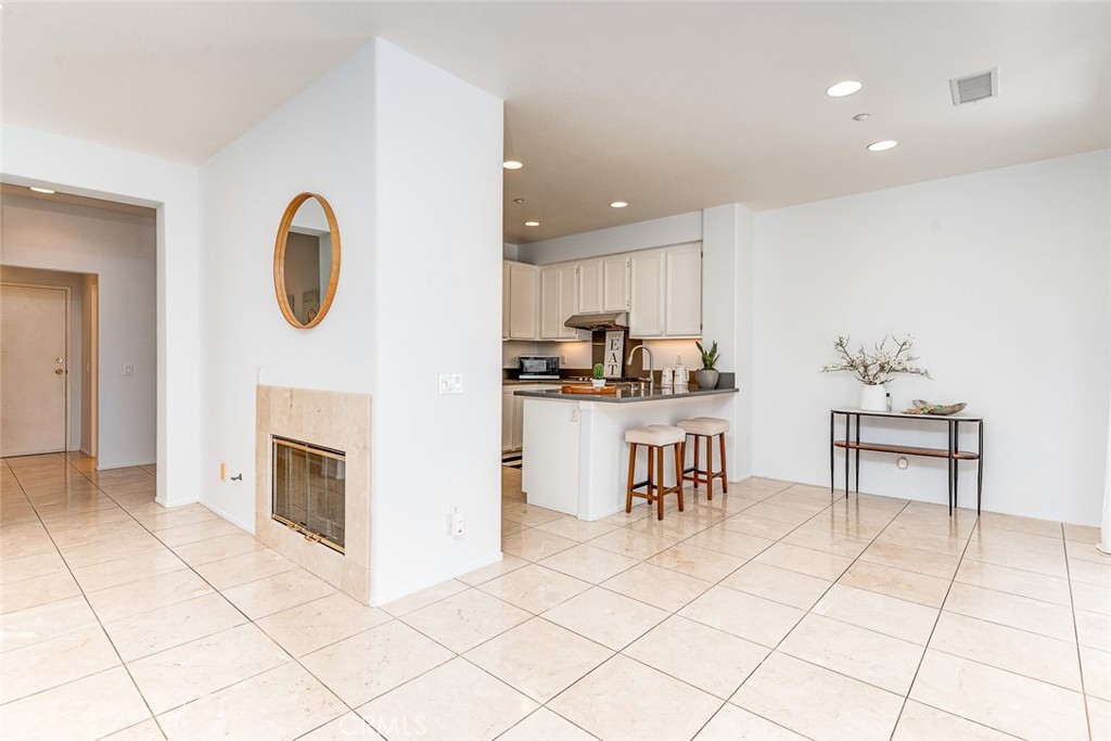 38 Daisy Irvine, CA 92618 - Photo 16 of 41 a kitchen with stainless steel appliances granite countertop a stove a sink and a microwave