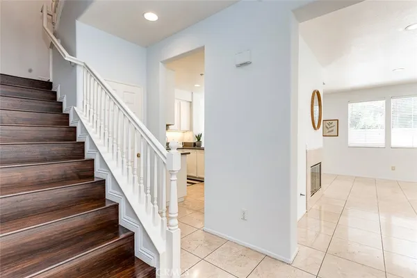 an empty room with wooden floor and a window