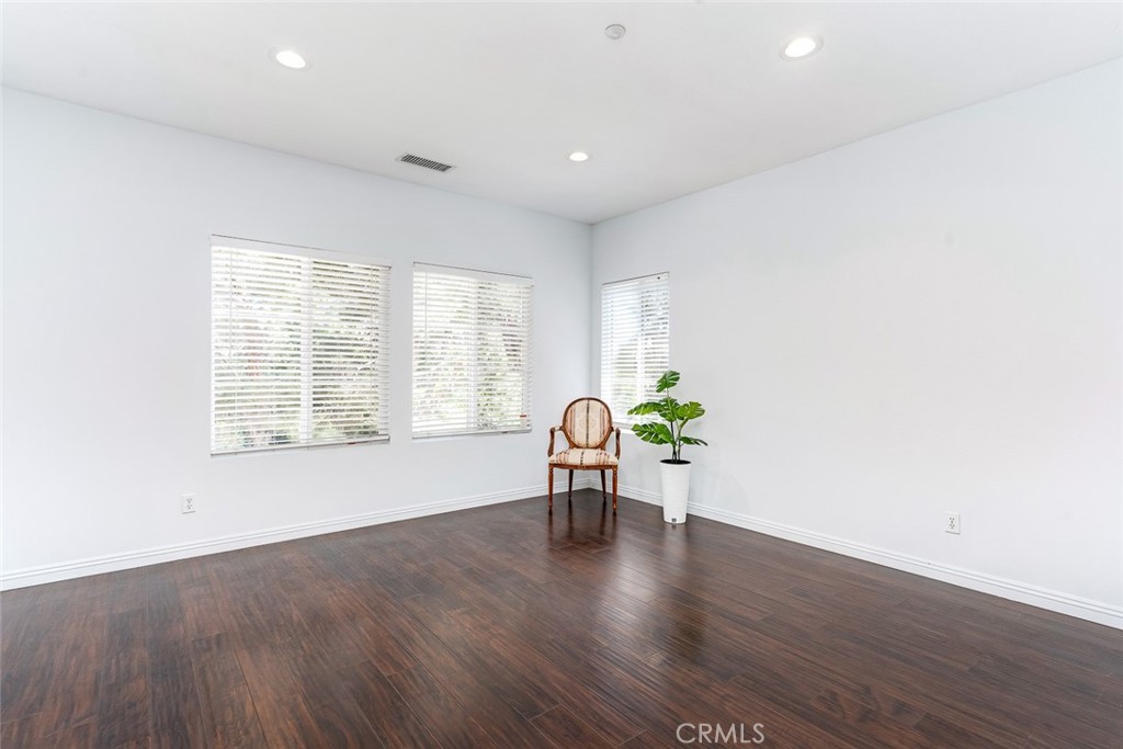 38 Daisy Irvine, CA 92618 - Photo 24 of 41 a view of an empty room with a window and wooden floor
