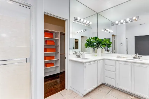 a view of a patio with table and chairs under an umbrella