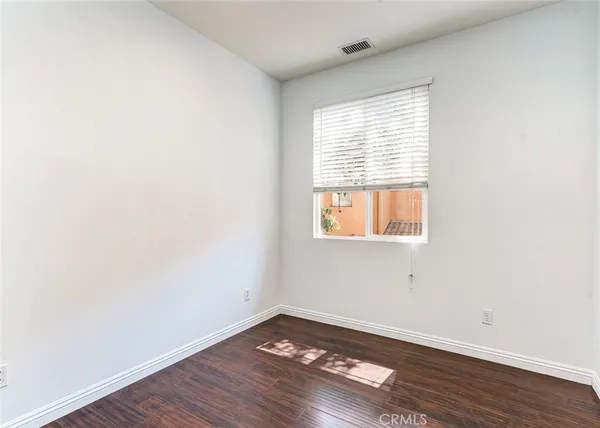 a aerial view of a house with garden space and street view