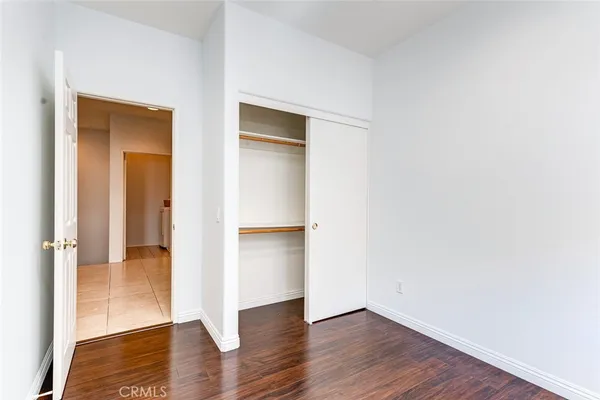 an aerial view of residential house with outdoor space and trees all around