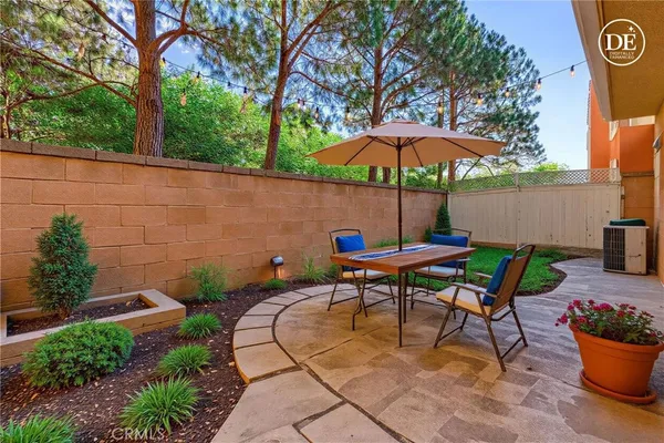an aerial view of a house with a garden and plants