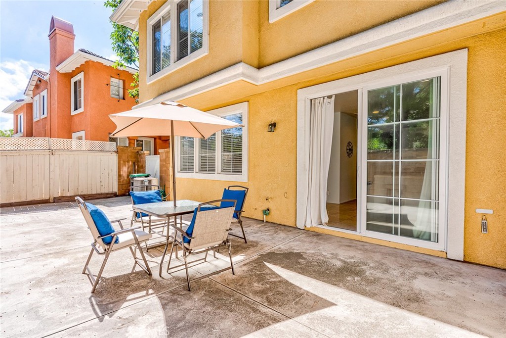 38 Daisy Irvine, CA 92618 - Photo 34 of 41 a view of a patio with table and chairs under an umbrella