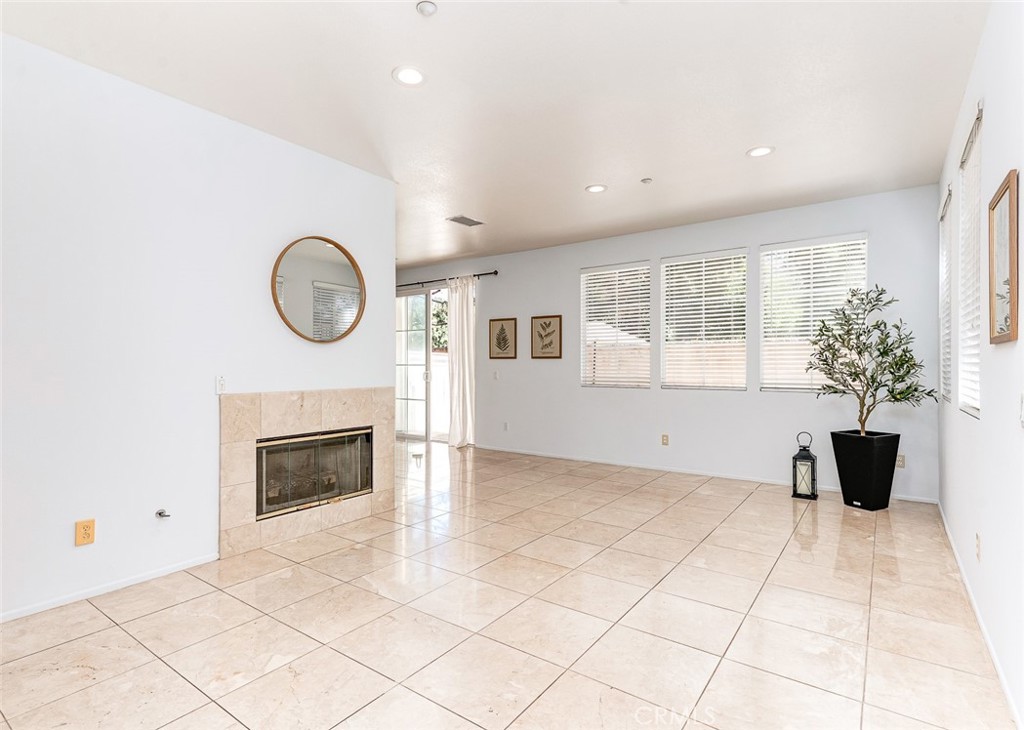 38 Daisy Irvine, CA 92618 - Photo 9 of 41 a view of an empty room with a fireplace and a window