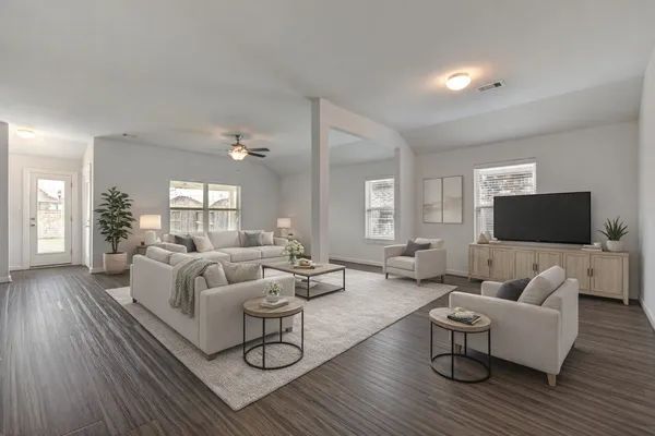 a living room with furniture and a flat screen tv