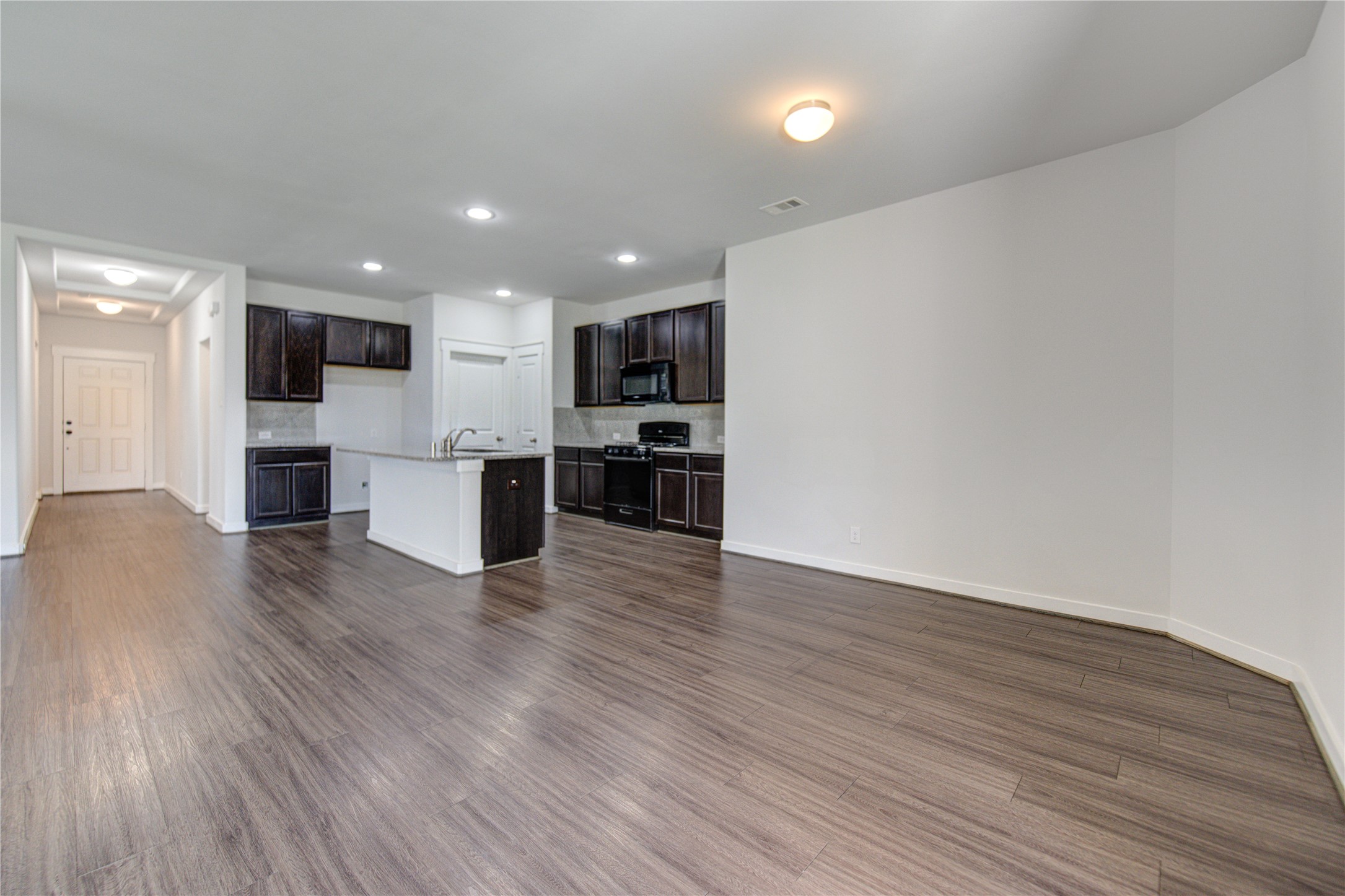 12326 Sabine Point Drive Humble, TX 77346 - Photo 14 of 42 a view of kitchen with microwave and refrigerator