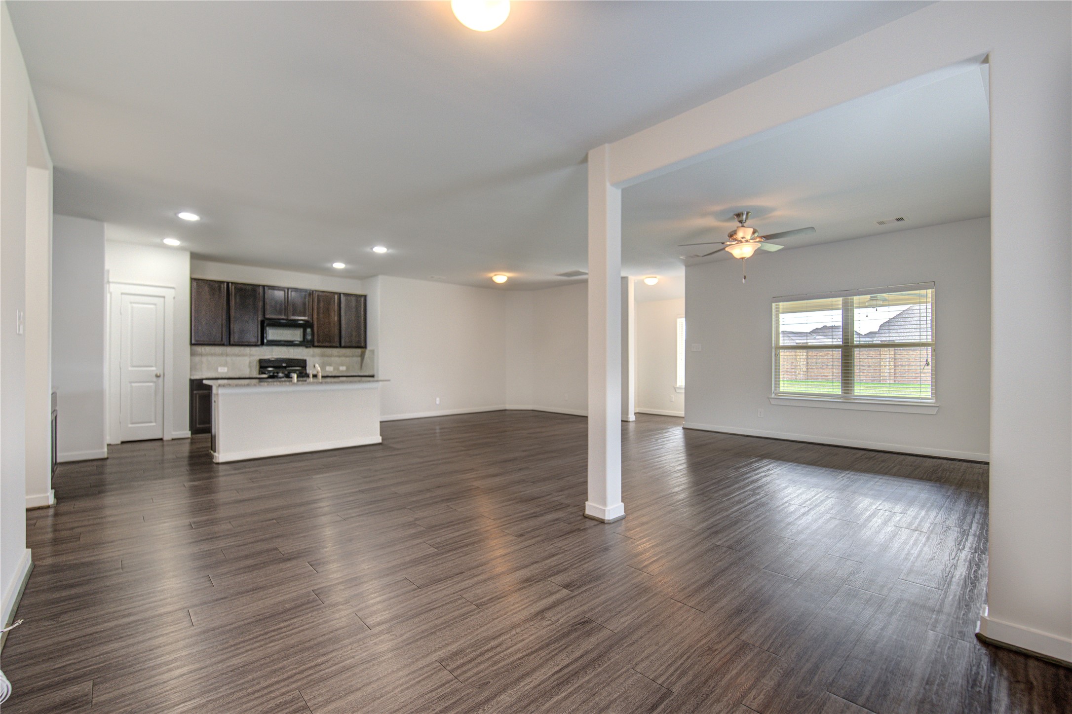 12326 Sabine Point Drive Humble, TX 77346 - Photo 16 of 42 a view of kitchen with cabinets and wooden floor
