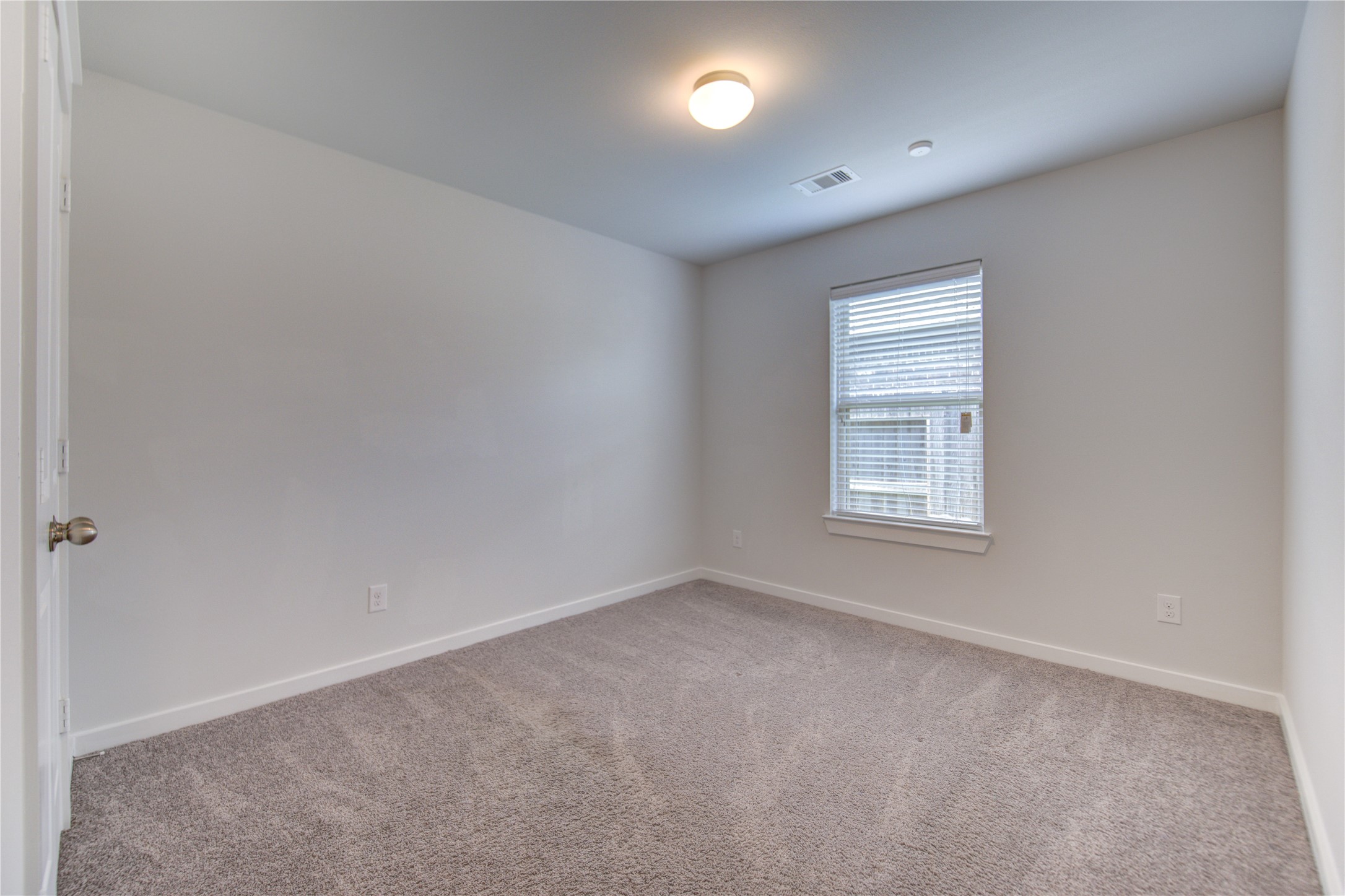 12326 Sabine Point Drive Humble, TX 77346 - Photo 30 of 42 an empty room with windows