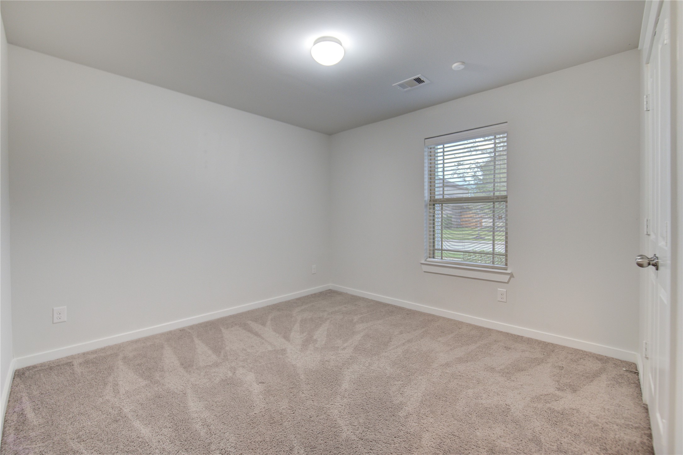 12326 Sabine Point Drive Humble, TX 77346 - Photo 33 of 42 an empty room with windows
