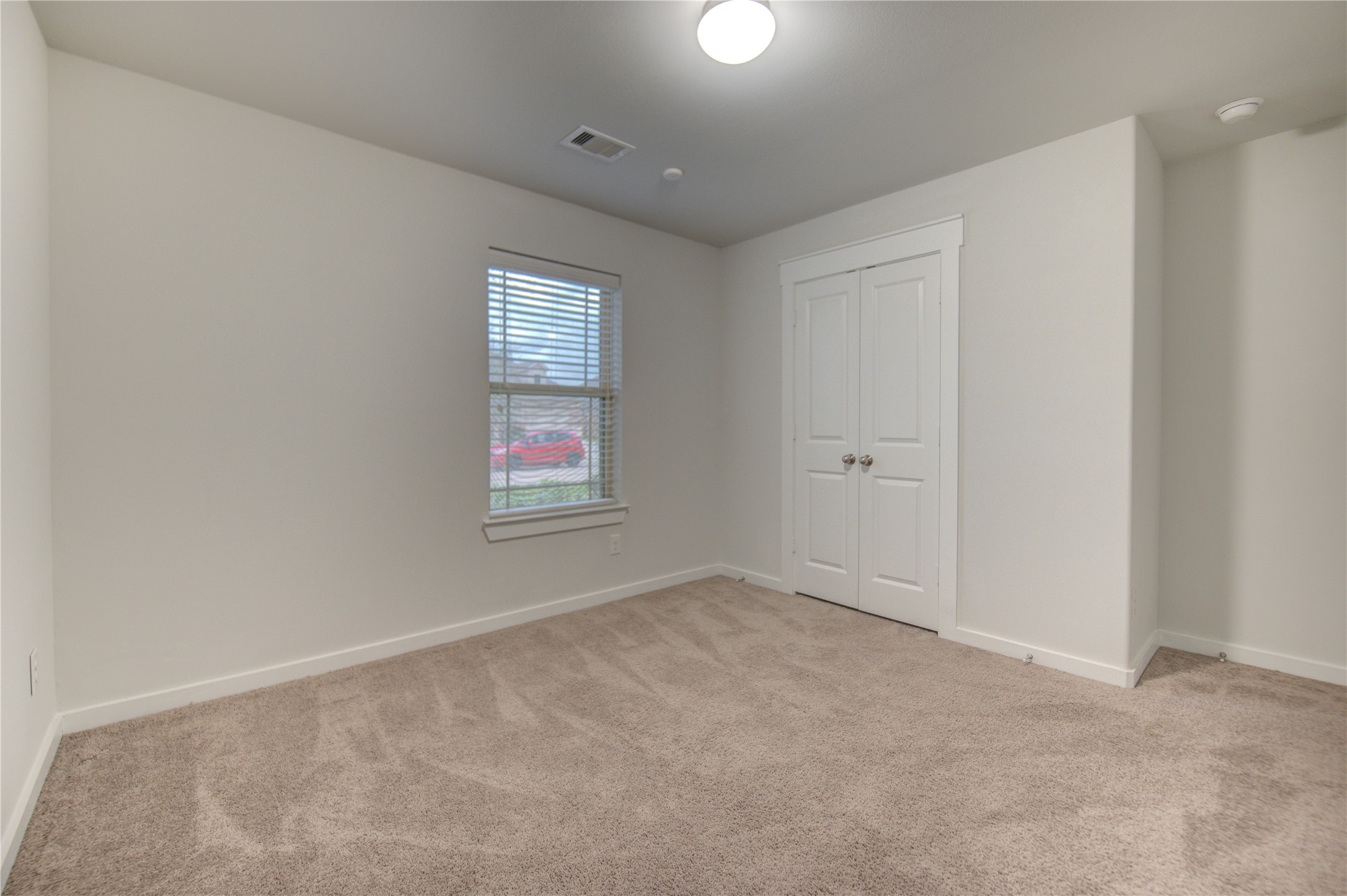 12326 Sabine Point Drive Humble, TX 77346 - Photo 34 of 42 an empty room with windows