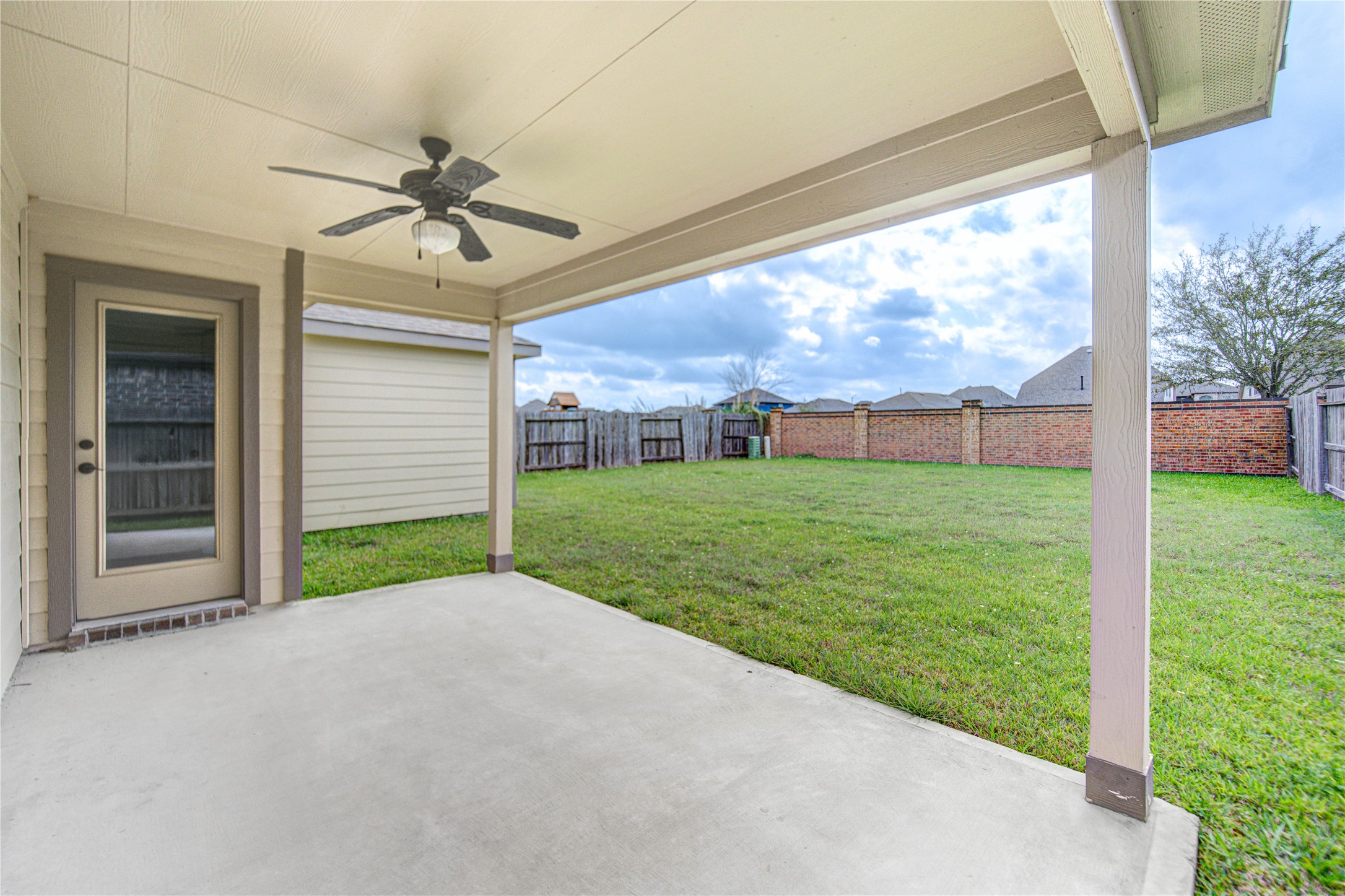 12326 Sabine Point Drive Humble, TX 77346 - Photo 38 of 42 a view of a porch with a yard