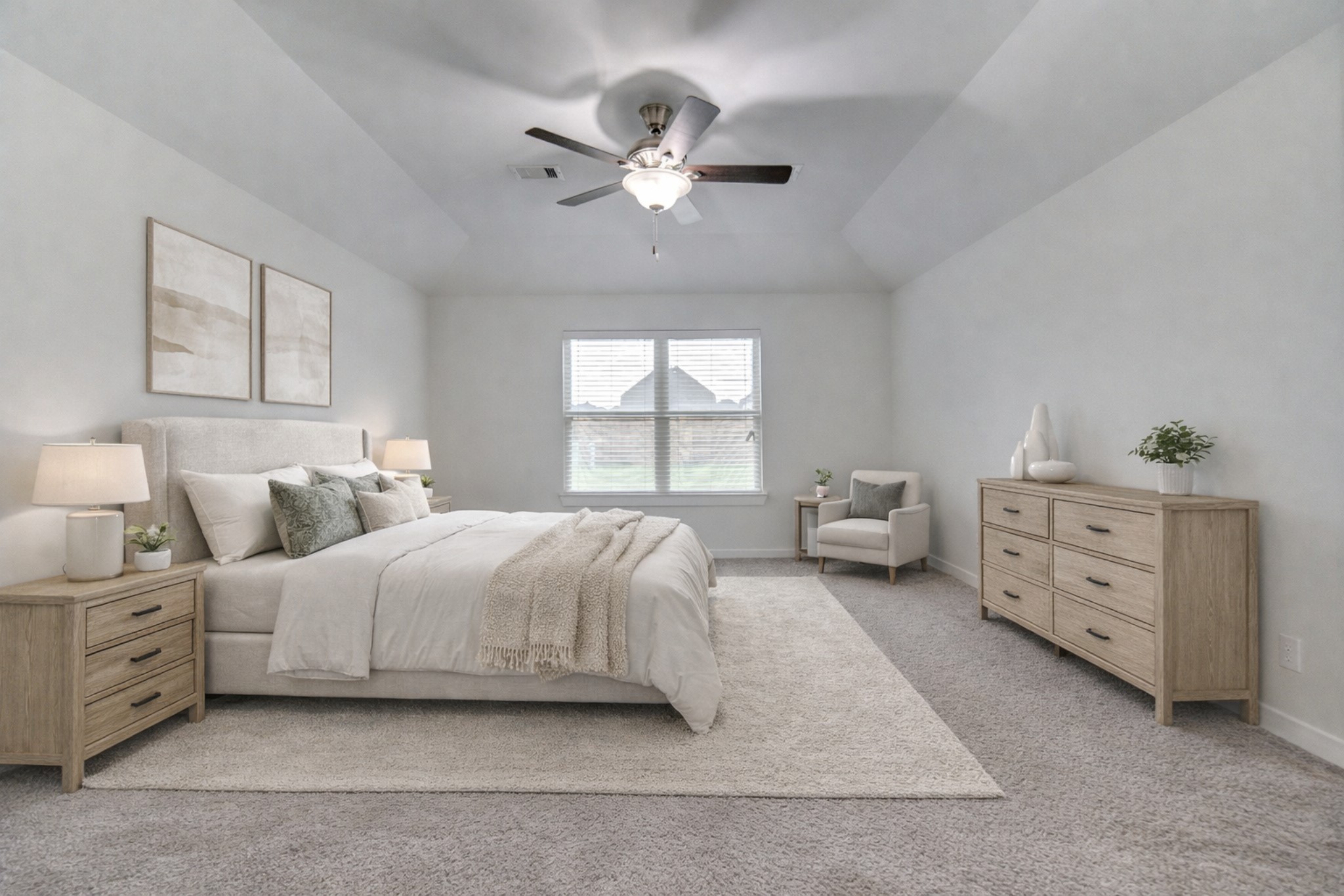 12326 Sabine Point Drive Humble, TX 77346 - Photo 4 of 42 a spacious bedroom with a large bed and a chandelier