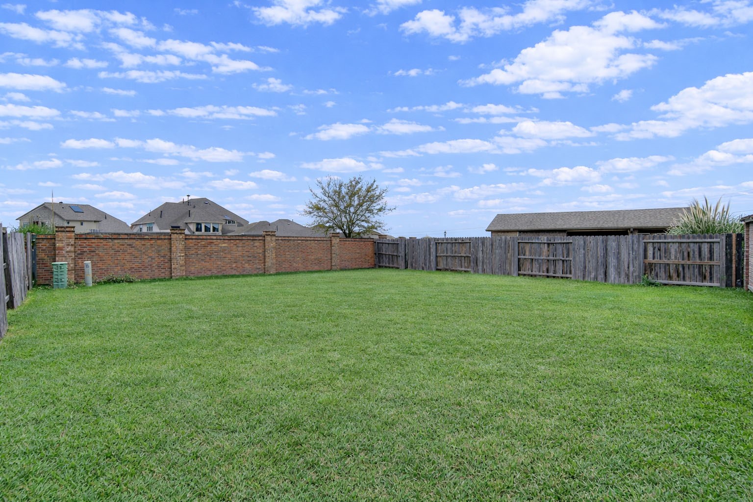 12326 Sabine Point Drive Humble, TX 77346 - Photo 41 of 42 a view of yard with swimming pool and wooden fence