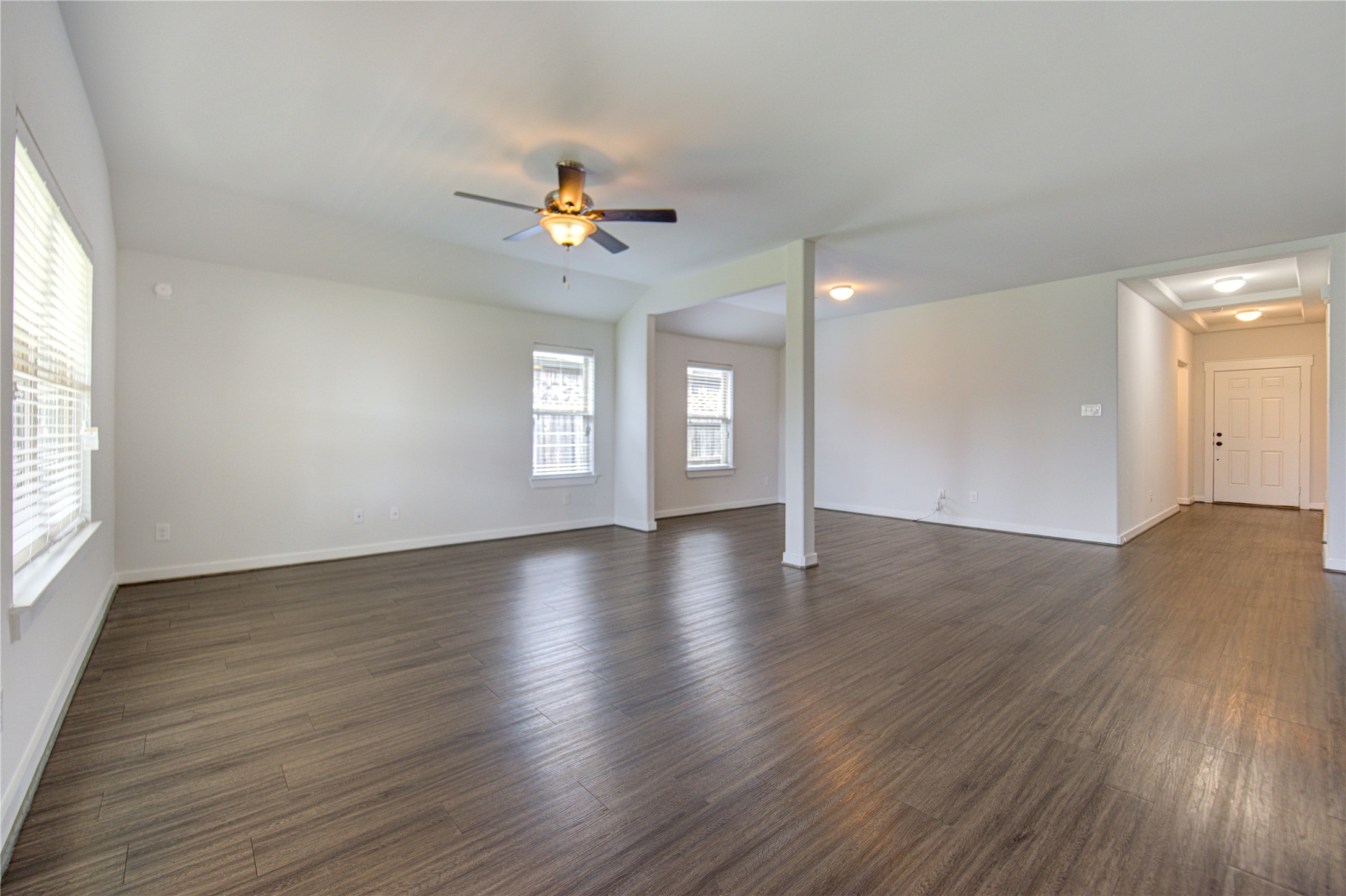 12326 Sabine Point Drive Humble, TX 77346 - Photo 7 of 42 an empty room with wooden floor and window