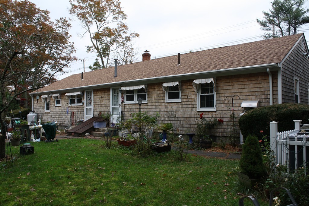 28 Morton Road Freetown, MA 02717 - Photo 5 of 29 a front view of house with yard and outdoor seating