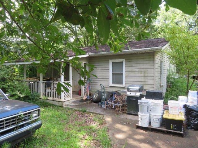 649 Schaffer Road Marietta, GA 30008 - Photo 1 of 1 a backyard of a house with table and chairs
