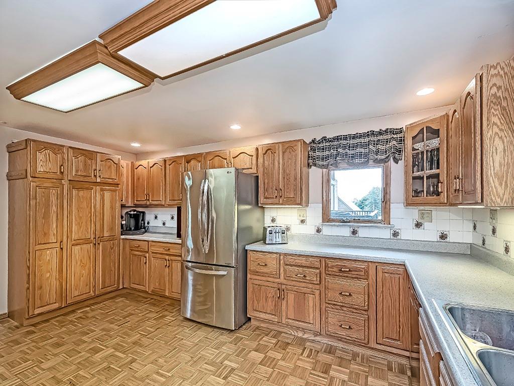 111 Brinker Road Butler, PA 16002 - Photo 8 of 23 a kitchen with refrigerator cabinets and a sink