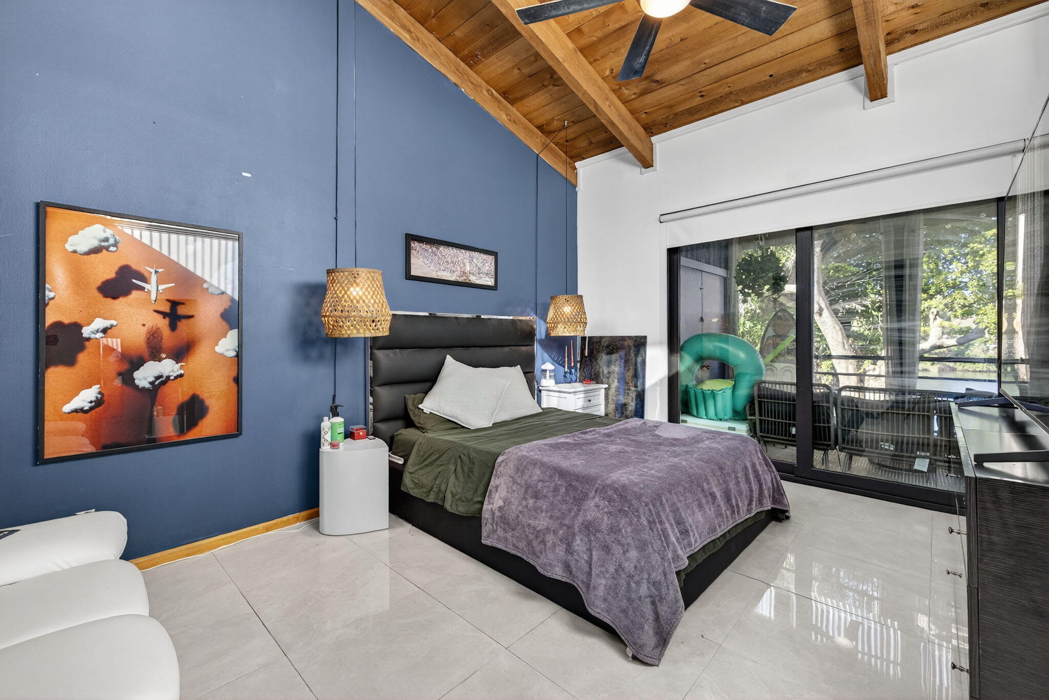 4491 Crystal Lake Drive, Unit 201A Deerfield Beach, FL 33073 - Photo 20 of 36 a living room with a bed furniture and a large window