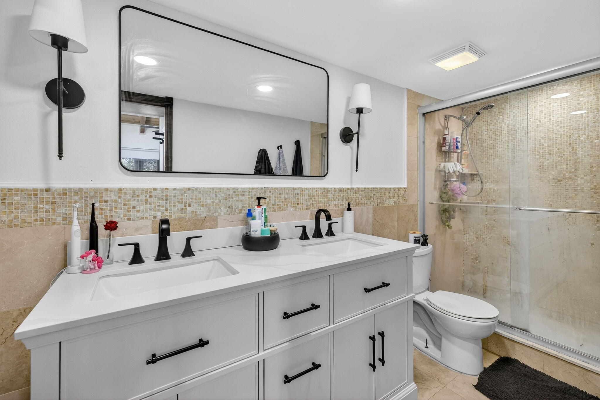 4491 Crystal Lake Drive, Unit 201A Deerfield Beach, FL 33073 - Photo 22 of 36 a bathroom with a sink a toilet and a shower