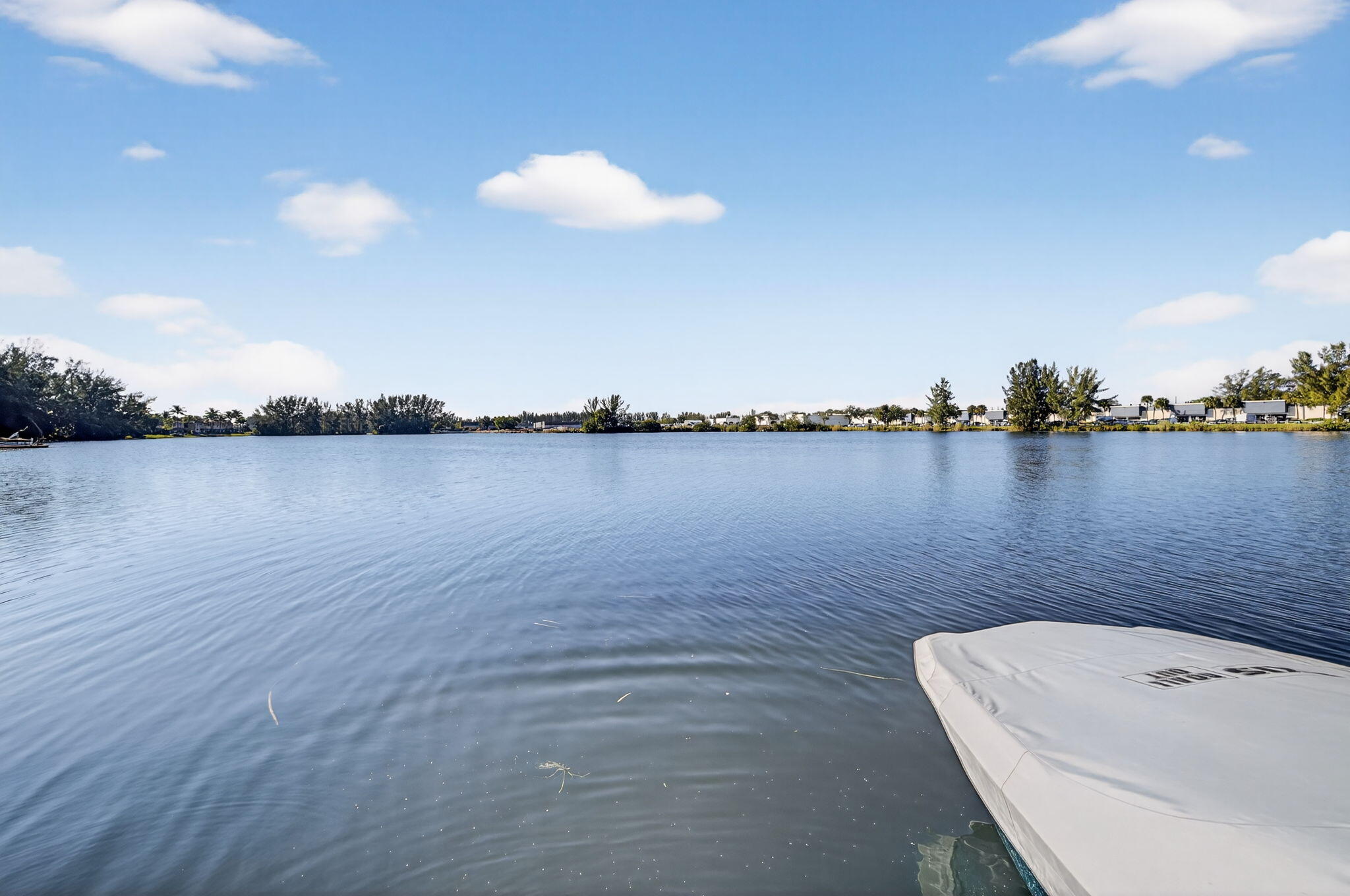 4491 Crystal Lake Drive, Unit 201A Deerfield Beach, FL 33073 - Photo 33 of 36 a view of a lake with outdoor space