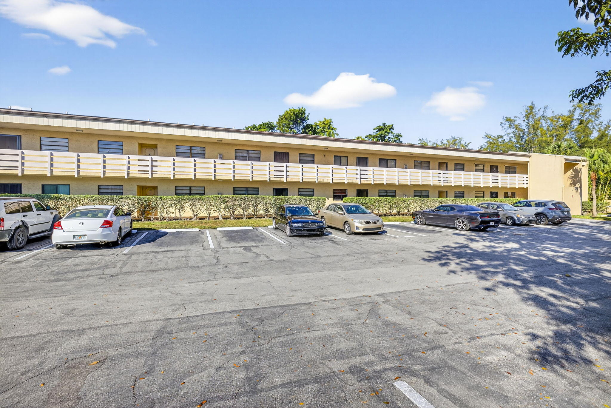 4491 Crystal Lake Drive, Unit 201A Deerfield Beach, FL 33073 - Photo 5 of 36 a cars parked in front of a building