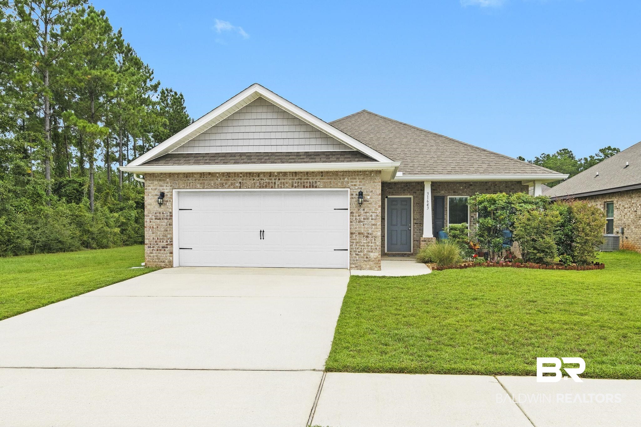 31643 Kestrel Loop Daphne, AL 36527 - Photo 1 of 59 Craftsman-style home with a garage, central AC unit, and a front yard