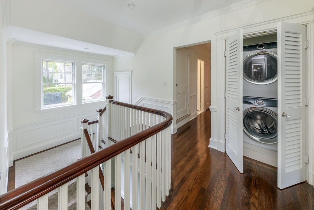 25 Bonad Road Newton, MA 02465 - Photo 13 of 26 a view of a hallway with washer and dryer