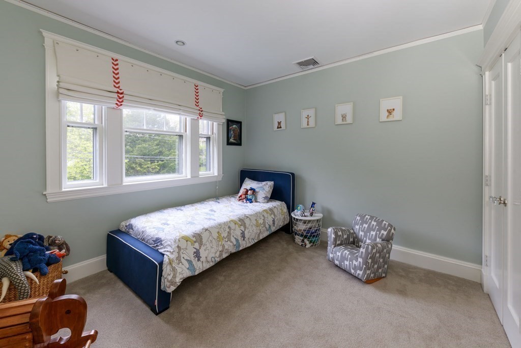 25 Bonad Road Newton, MA 02465 - Photo 18 of 26 a bedroom with a bed and a window