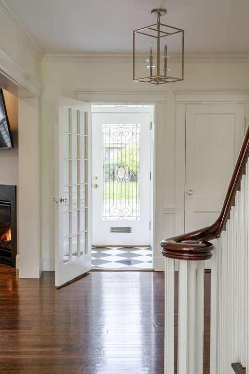 25 Bonad Road Newton, MA 02465 - Photo 3 of 26 a view of entryway with hardwood floor and front door