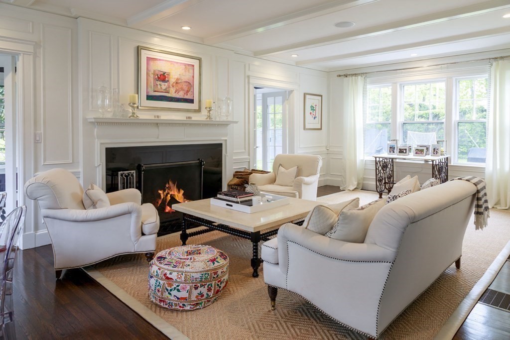25 Bonad Road Newton, MA 02465 - Photo 9 of 26 a living room with furniture and a fireplace