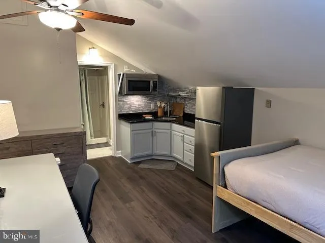 a kitchen with a sink and a stove top oven