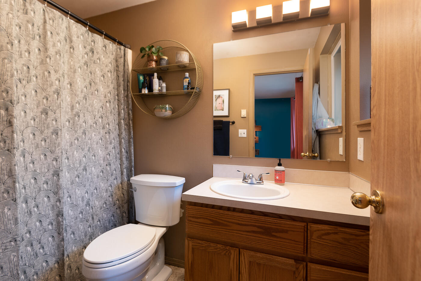 17270 Gadwall Road Bend, OR 97707 - Photo 15 of 30 a bathroom with a toilet a sink and mirror