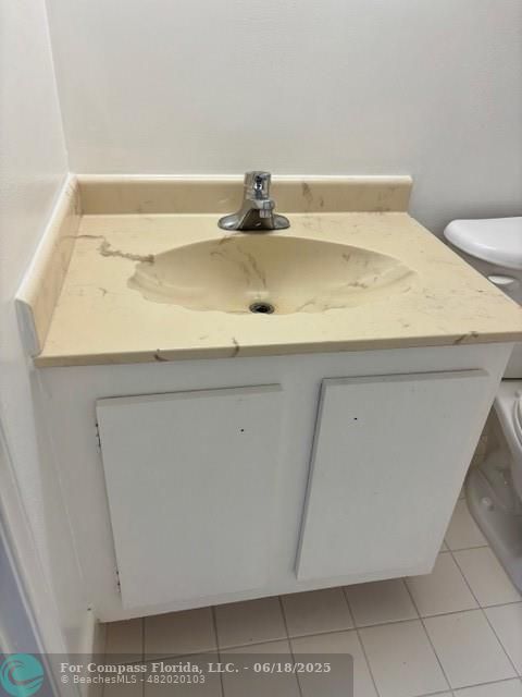 1421 South Ocean Boulevard, Unit 218 Pompano Beach, FL 33062 - Photo 7 of 10 a bathroom with a sink and vanity
