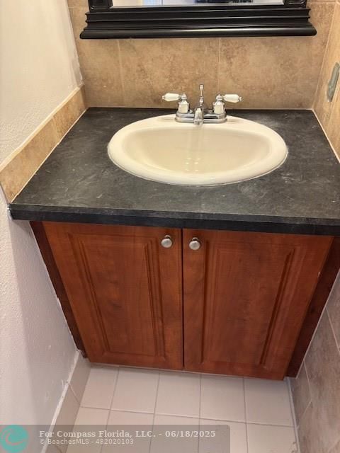 1421 South Ocean Boulevard, Unit 218 Pompano Beach, FL 33062 - Photo 8 of 10 a bathroom with a sink and a mirror