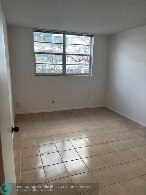 1421 South Ocean Boulevard, Unit 218 Pompano Beach, FL 33062 - Photo 10 of 10 an empty room with windows