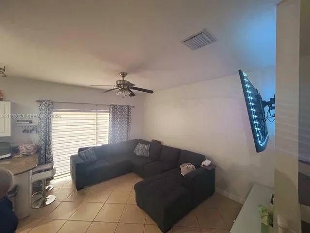 a living room with furniture and a window