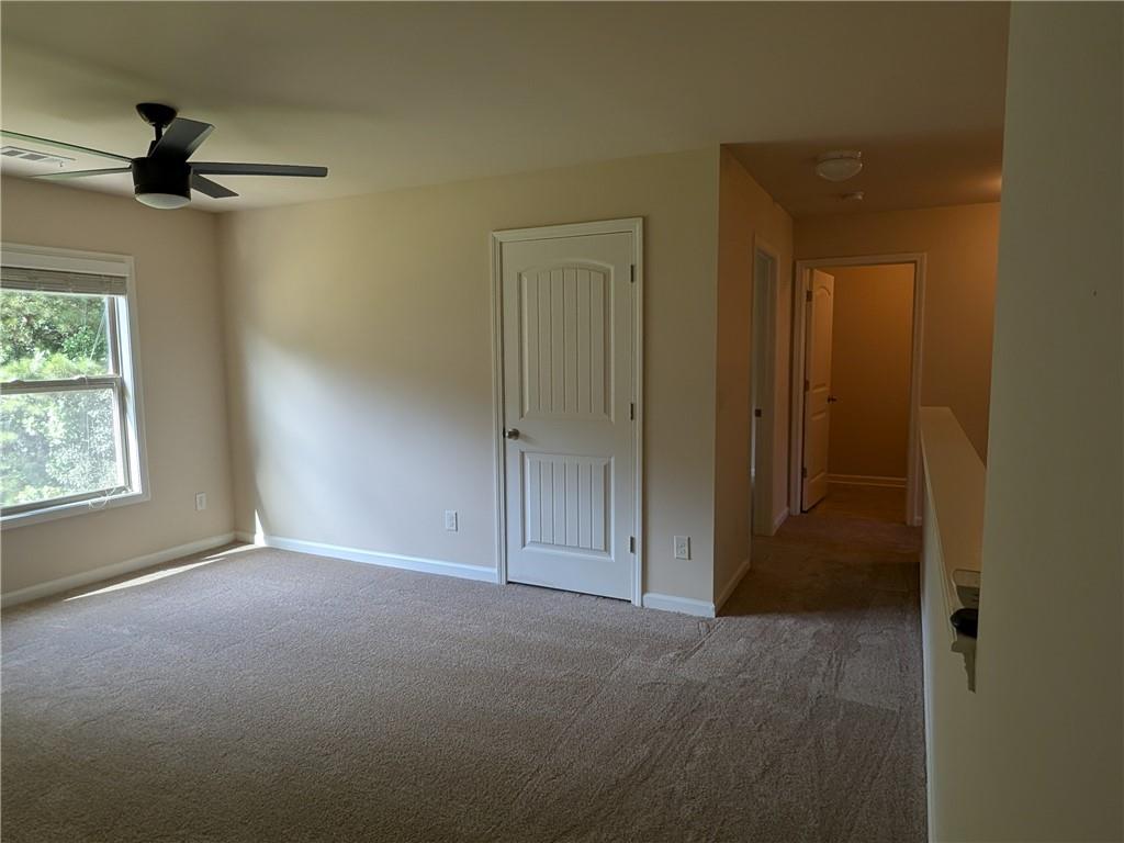 105 Whitney Way Dallas, GA 30157 - Photo 16 of 30 an empty room with windows and closet