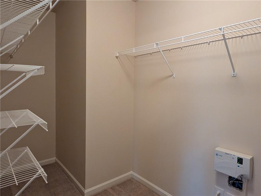 105 Whitney Way Dallas, GA 30157 - Photo 22 of 30 a view of storage and utility room with racks on the wall