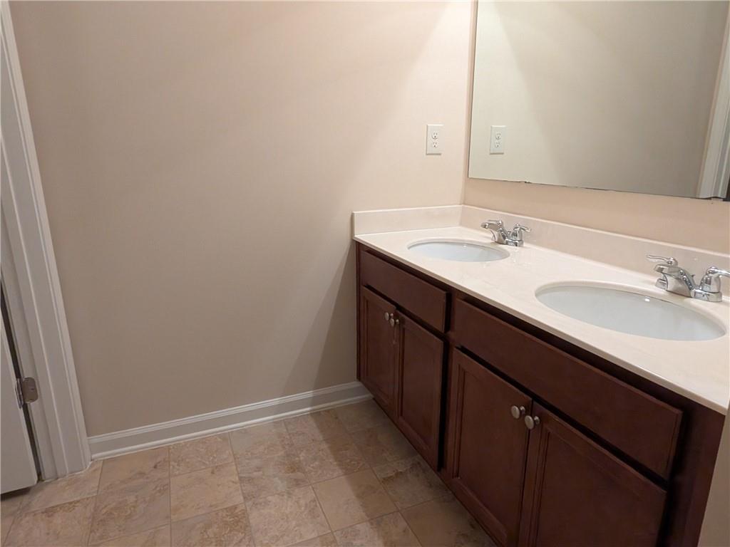 105 Whitney Way Dallas, GA 30157 - Photo 25 of 30 a bathroom with a sink and a mirror