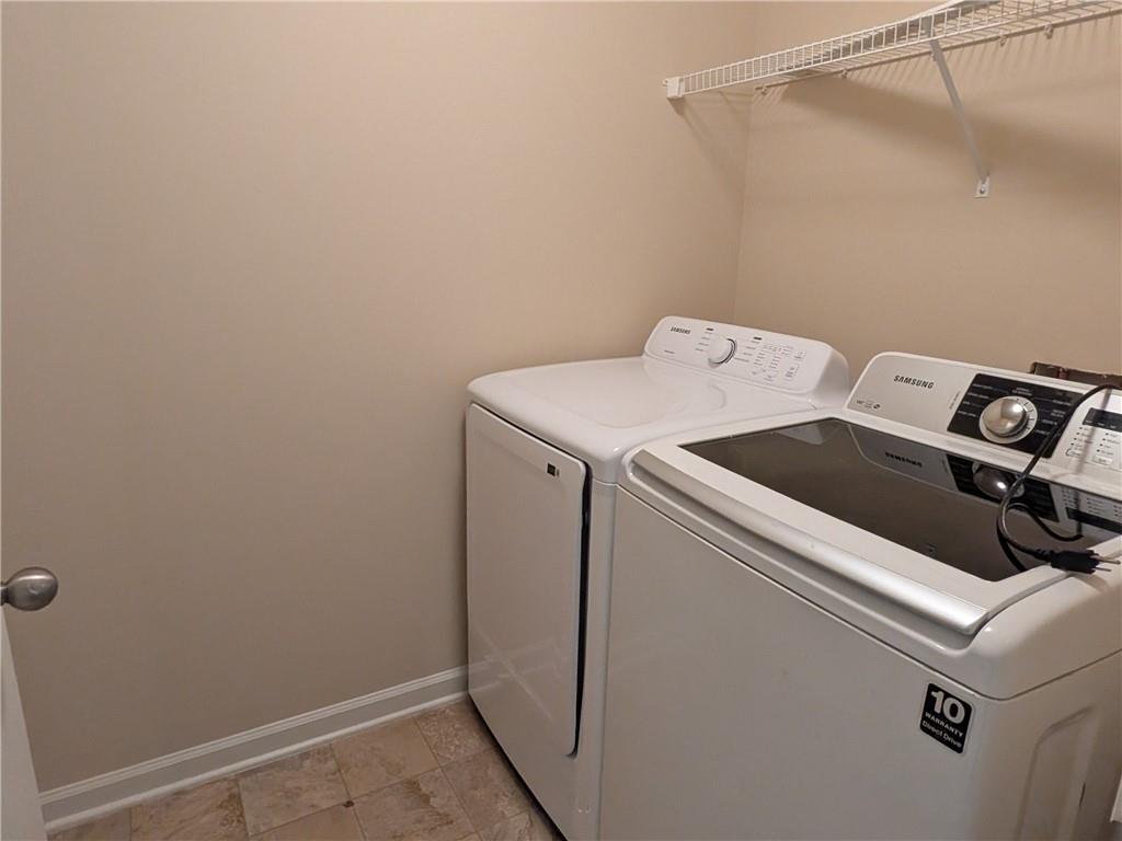 105 Whitney Way Dallas, GA 30157 - Photo 27 of 30 a utility room with dryer and washer
