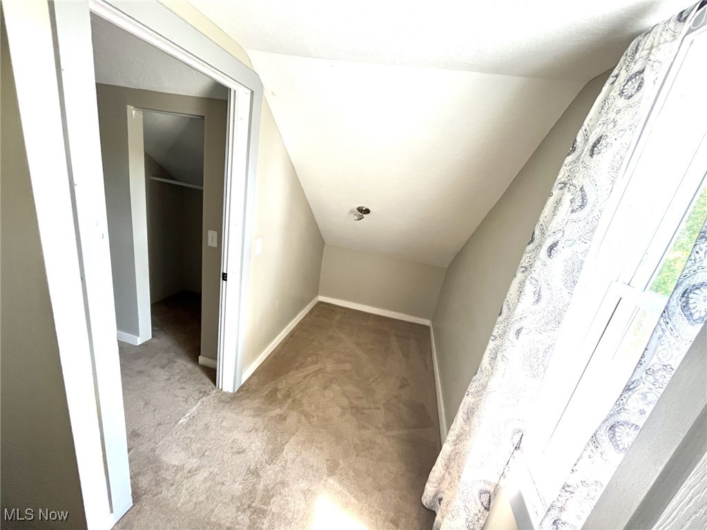 4440 Dryden Court Southwest Canton, OH 44708 - Photo 26 of 28 Bonus room with carpet and lofted ceiling