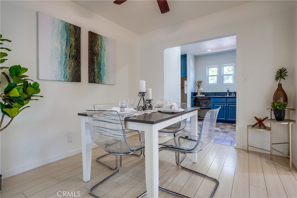 4037 East 7th Street Long Beach, CA 90804 - Photo 5 of 13 a view of a dining room with furniture and wooden floor