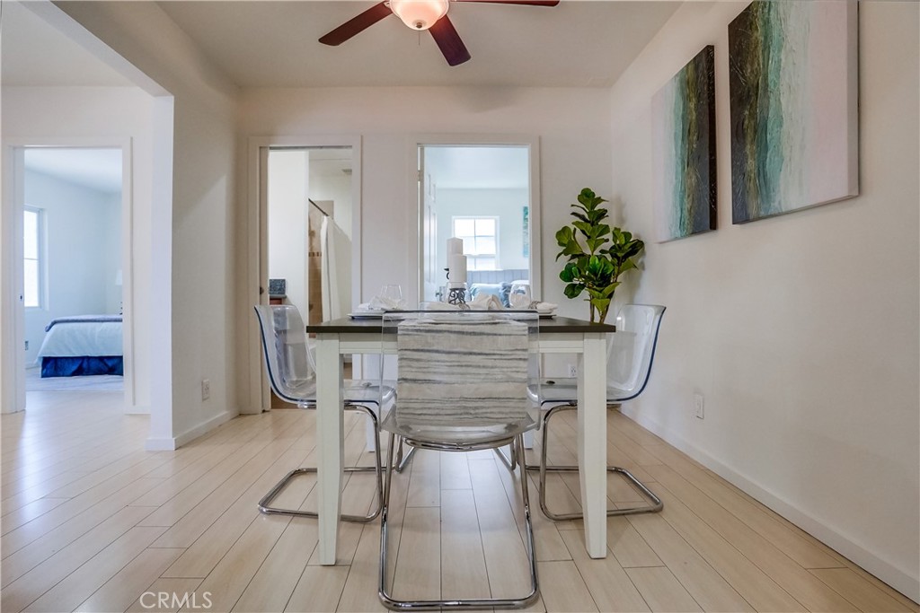 4037 East 7th Street Long Beach, CA 90804 - Photo 6 of 13 a dining room with furniture and wooden floor