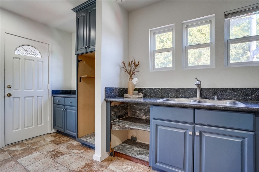 4037 East 7th Street Long Beach, CA 90804 - Photo 8 of 13 a kitchen with cabinets a sink and appliances