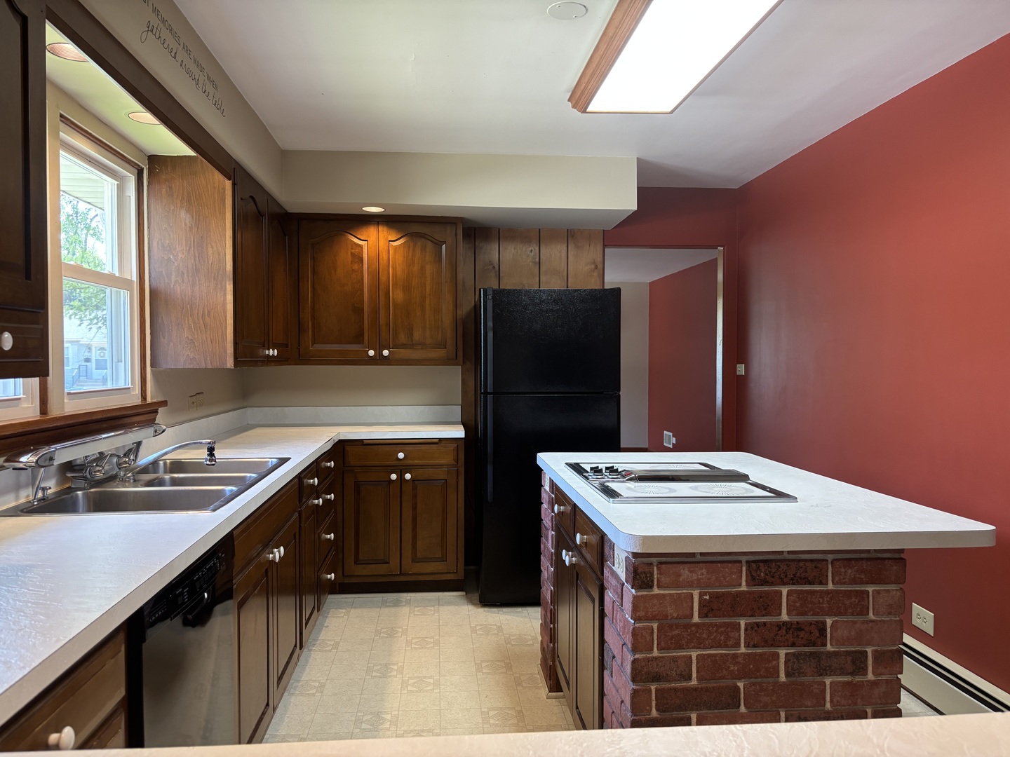 1378 East Street Crete, IL 60417 - Photo 3 of 12 a kitchen with stainless steel appliances kitchen island granite countertop a sink stove and refrigerator