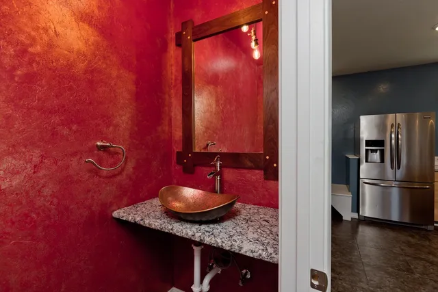 a bathroom with a sink and a mirror