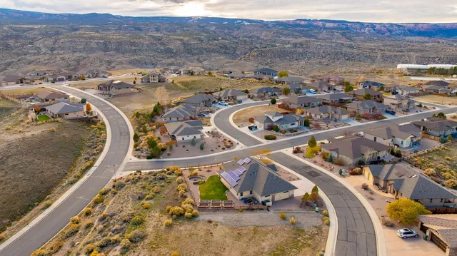an aerial view of residential houses with outdoor space