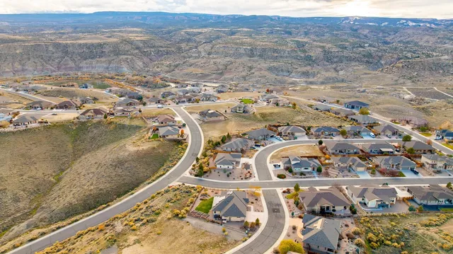 an aerial view of a house with a lake view