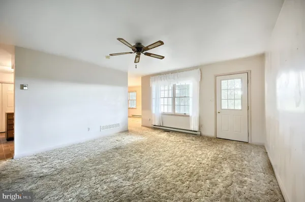 a view of an empty room with a window